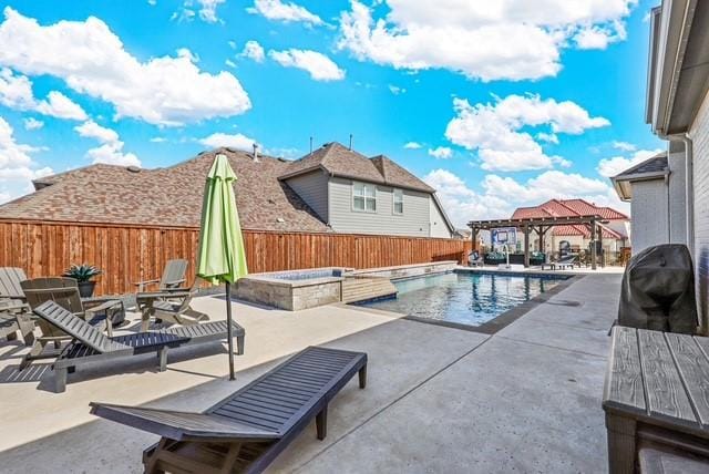 view of swimming pool with a fenced in pool, a patio, grilling area, an in ground hot tub, and a fenced backyard