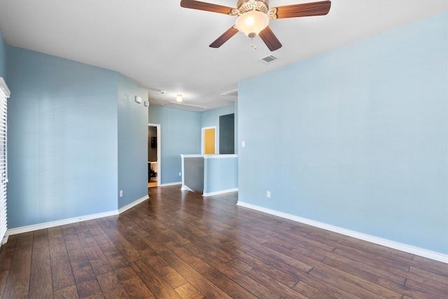 unfurnished room featuring visible vents, ceiling fan, baseboards, and hardwood / wood-style flooring