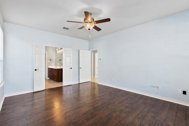 unfurnished bedroom featuring light wood-type flooring, baseboards, visible vents, and ensuite bathroom