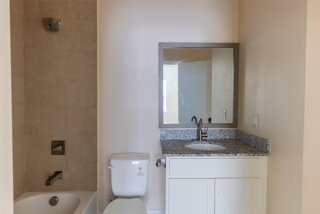 full bathroom with tub / shower combination, vanity, and toilet