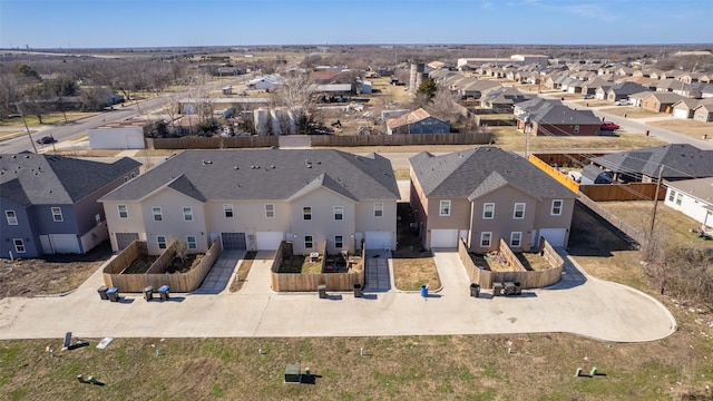 birds eye view of property with a residential view