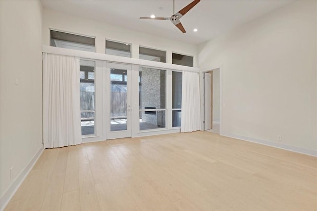 unfurnished room featuring baseboards, recessed lighting, a ceiling fan, and light wood-style floors