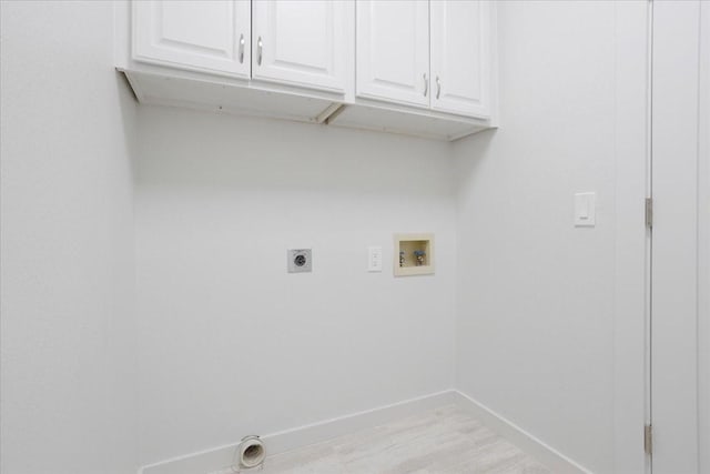 laundry room featuring light wood-style flooring, washer hookup, baseboards, cabinet space, and electric dryer hookup