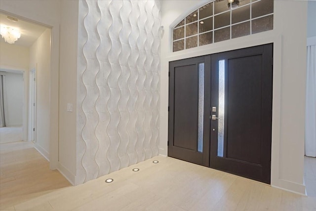 foyer featuring wood finished floors