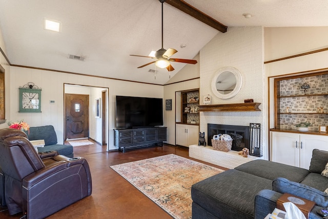 living area with a brick fireplace, a textured ceiling, visible vents, and beamed ceiling