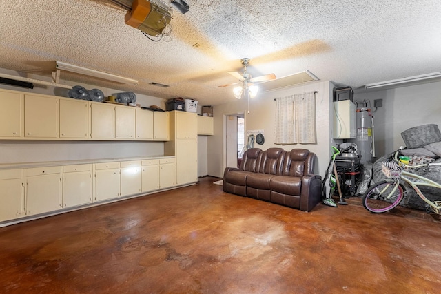 garage featuring a ceiling fan, electric water heater, and a garage door opener