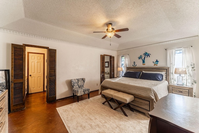 bedroom with finished concrete flooring, ceiling fan, baseboards, and a textured ceiling