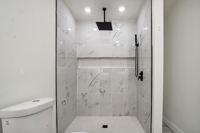 full bathroom featuring marble finish floor, a marble finish shower, toilet, and baseboards