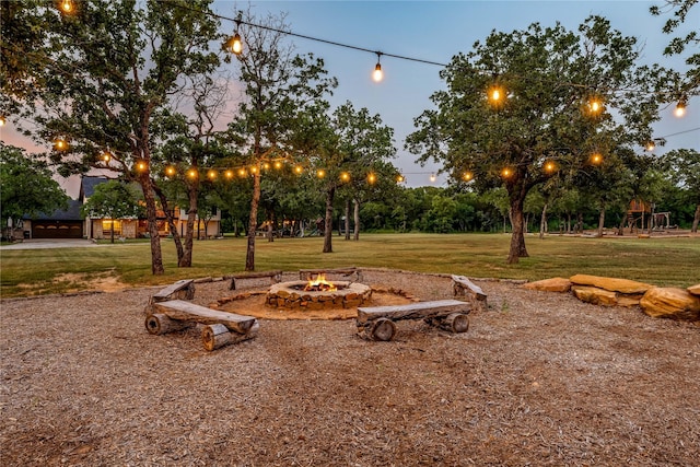 3113 Rock Creek Rd, Mineral Wells, TX 76067 - yard at dusk featuring a fire pit