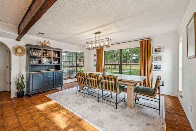 3113 Rock Creek Rd, Mineral Wells, TX 76067 - dining area featuring arched walkways, a textured ceiling, a chandelier, and visible vents