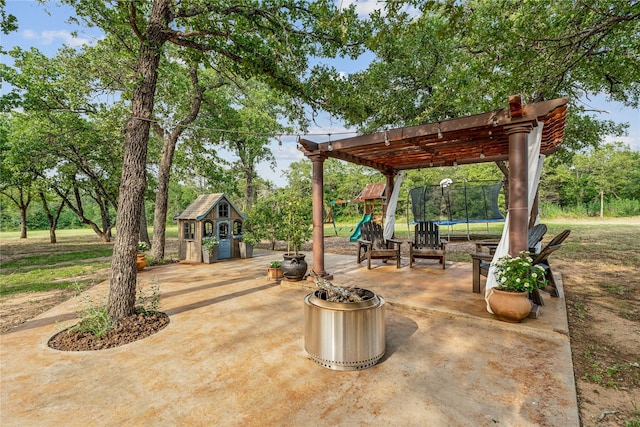 3113 Rock Creek Rd, Mineral Wells, TX 76067 - view of patio featuring a trampoline, playground community, and an outdoor structure
