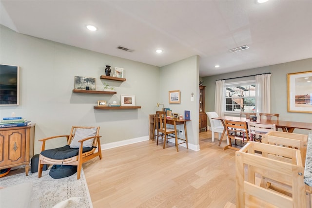 interior space featuring recessed lighting, light wood-type flooring, visible vents, and baseboards