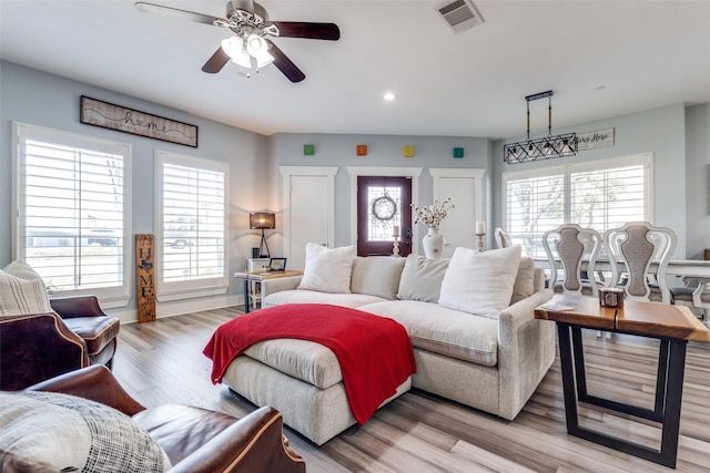 bedroom with light wood-style floors, ceiling fan, visible vents, and recessed lighting