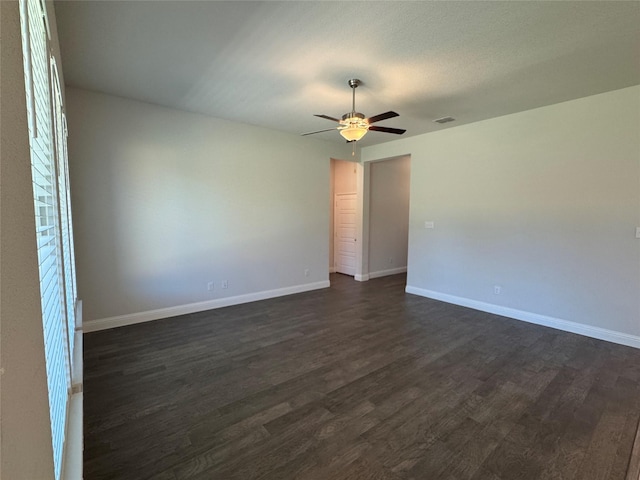 1433 Eagle Nest Dr, Pelican Bay, TX 76020 - spare room featuring dark wood-type flooring, a ceiling fan, and baseboards