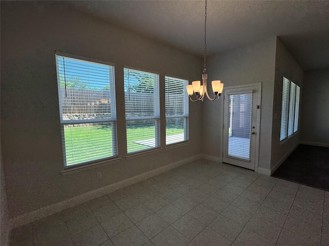 1433 Eagle Nest Dr, Pelican Bay, TX 76020 - unfurnished dining area with a chandelier, baseboards, and a textured ceiling