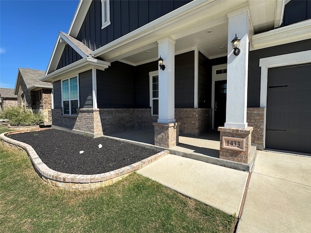 1433 Eagle Nest Dr, Pelican Bay, TX 76020 - entrance to property with board and batten siding, a porch, and a garage