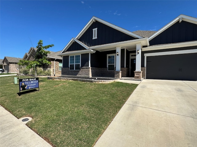 1433 Eagle Nest Dr, Pelican Bay, TX 76020 - craftsman inspired home with board and batten siding, a front yard, brick siding, a garage, and covered porch
