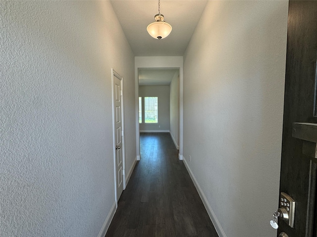 1433 Eagle Nest Dr, Pelican Bay, TX 76020 - corridor featuring dark wood finished floors, baseboards, and a textured wall