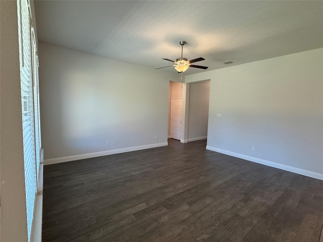 1433 Eagle Nest Dr, Pelican Bay, TX 76020 - spare room featuring dark wood-type flooring, ceiling fan, and baseboards