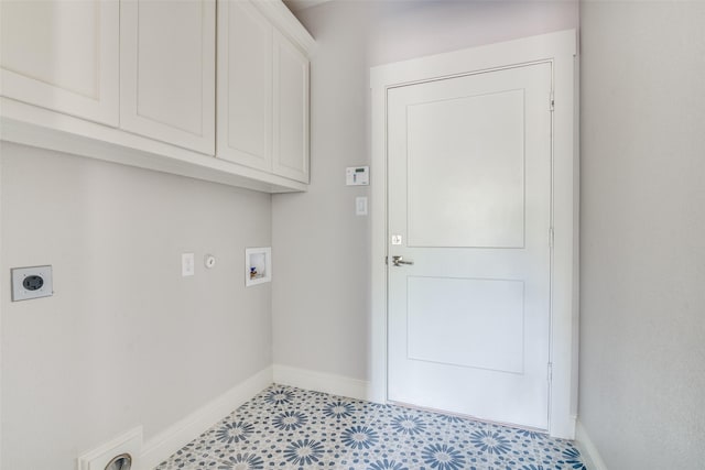 laundry area with cabinet space, hookup for a washing machine, baseboards, and hookup for an electric dryer