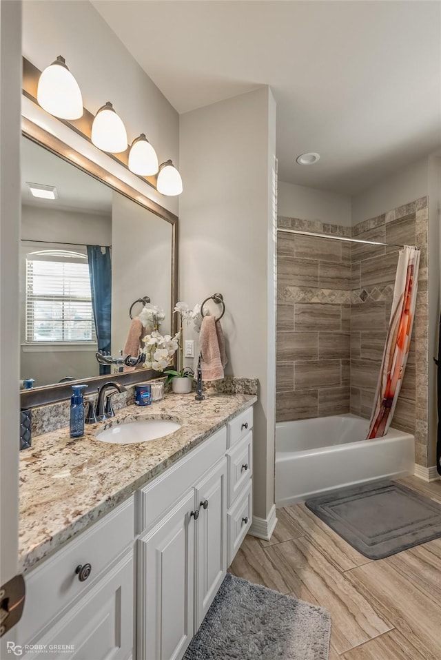 full bath with shower / bath combo with shower curtain and vanity