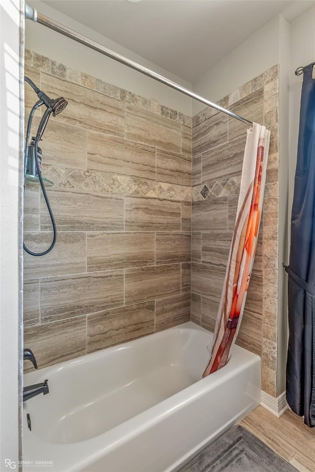 full bathroom featuring shower / bathtub combination with curtain and wood finished floors