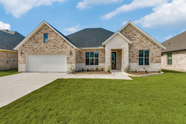 view of front of property featuring a garage, brick siding, driveway, roof with shingles, and a front lawn