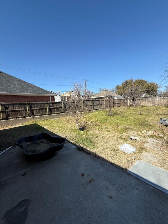 view of yard featuring a patio area and a fenced backyard