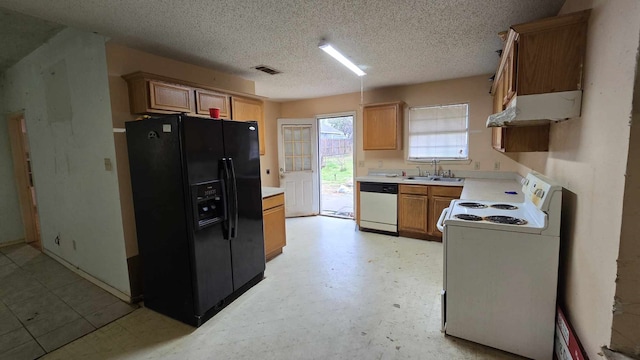 kitchen featuring white range with electric stovetop, light countertops, black fridge with ice dispenser, and dishwasher