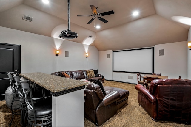 cinema featuring lofted ceiling, recessed lighting, visible vents, light carpet, and ceiling fan