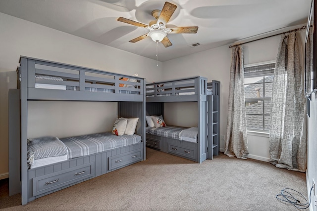 bedroom with a ceiling fan, light carpet, and visible vents