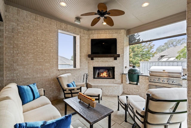 view of patio featuring ceiling fan, an outdoor living space with a fireplace, area for grilling, and a grill