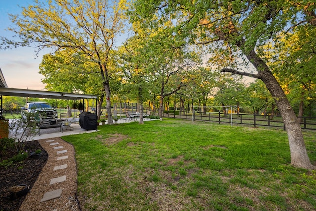 1036 Ten Box Rd, Sunset, TX 76270 - yard at dusk featuring fence and a patio area