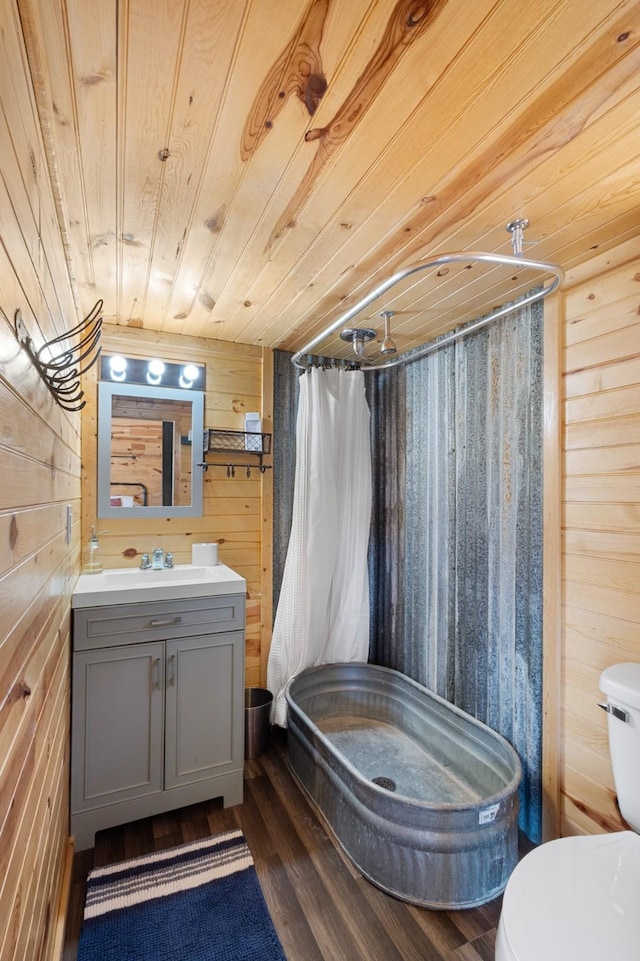 1036 Ten Box Rd, Sunset, TX 76270 - bathroom with wood walls, a stall shower, toilet, and wooden ceiling