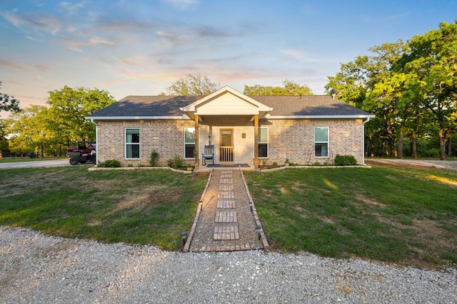 1036 Ten Box Rd, Sunset, TX 76270 - view of front of property featuring a shingled roof, brick siding, and a front lawn