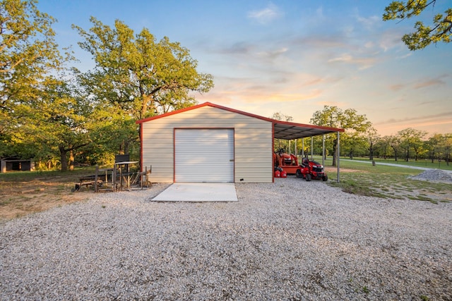1036 Ten Box Rd, Sunset, TX 76270 - garage at dusk featuring gravel driveway and a garage