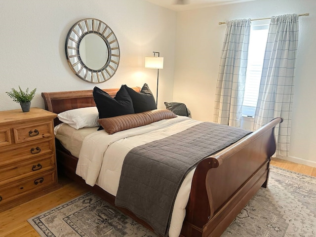 bedroom with wood finished floors