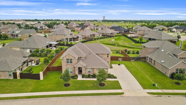 birds eye view of property with a residential view