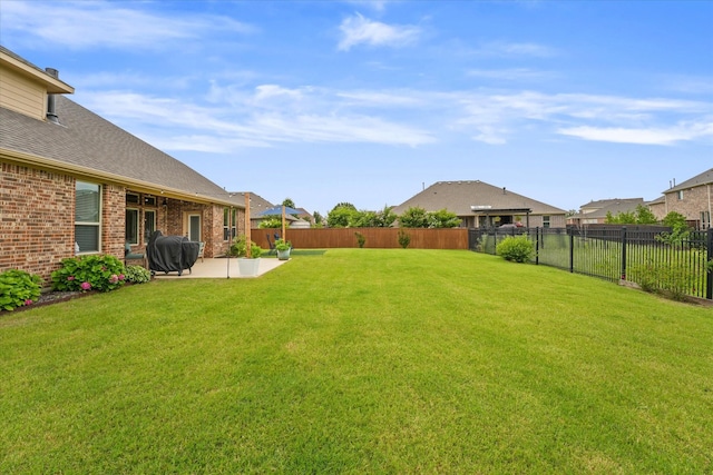 view of yard featuring a fenced backyard and a patio