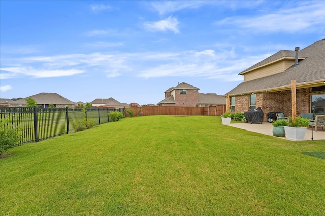 view of yard with a fenced backyard and a patio