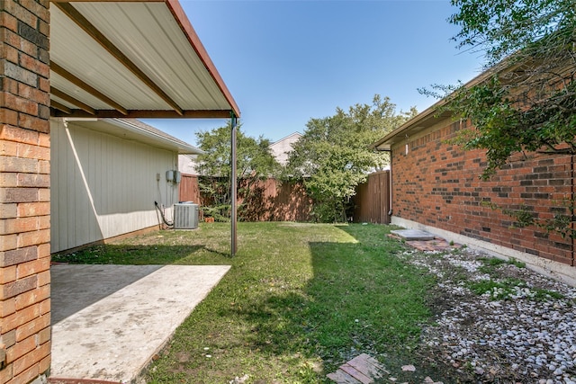 view of yard with cooling unit, a patio, and fence