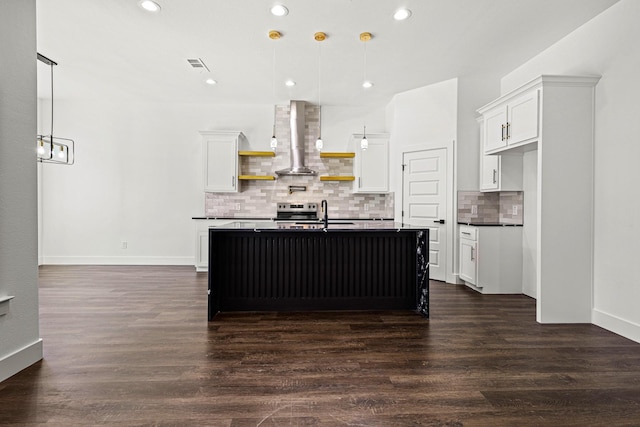 kitchen with dark wood-type flooring, visible vents, wall chimney range hood, open shelves, and dark countertops