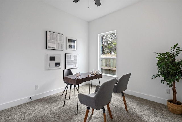 home office featuring carpet floors, a ceiling fan, and baseboards