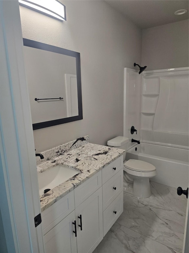 bathroom featuring toilet, marble finish floor, shower / bath combination, and vanity