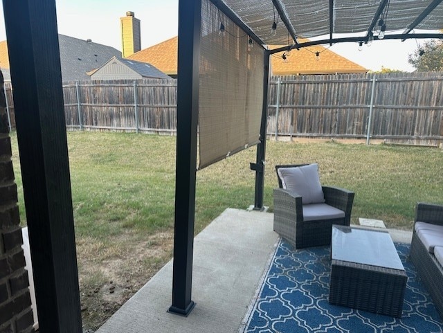 view of patio with an outdoor hangout area, a fenced backyard, and a pergola