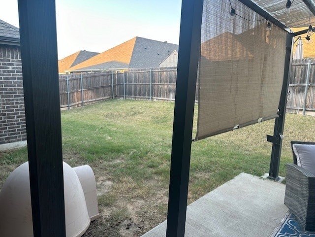 view of yard with a patio area and a fenced backyard