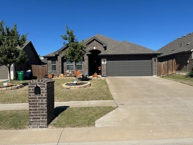 view of front of house with a garage, fence, concrete driveway, and brick siding