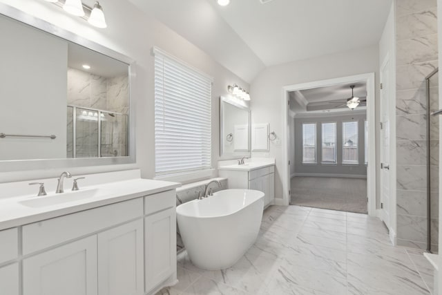 full bathroom featuring two vanities, a sink, marble finish floor, a soaking tub, and a shower stall