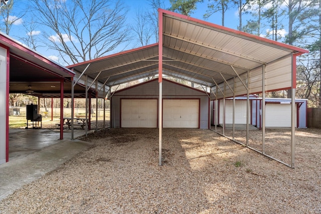 view of vehicle parking with a detached garage