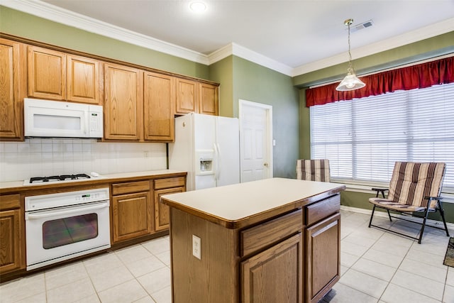 kitchen with light countertops, white appliances, brown cabinetry, and visible vents